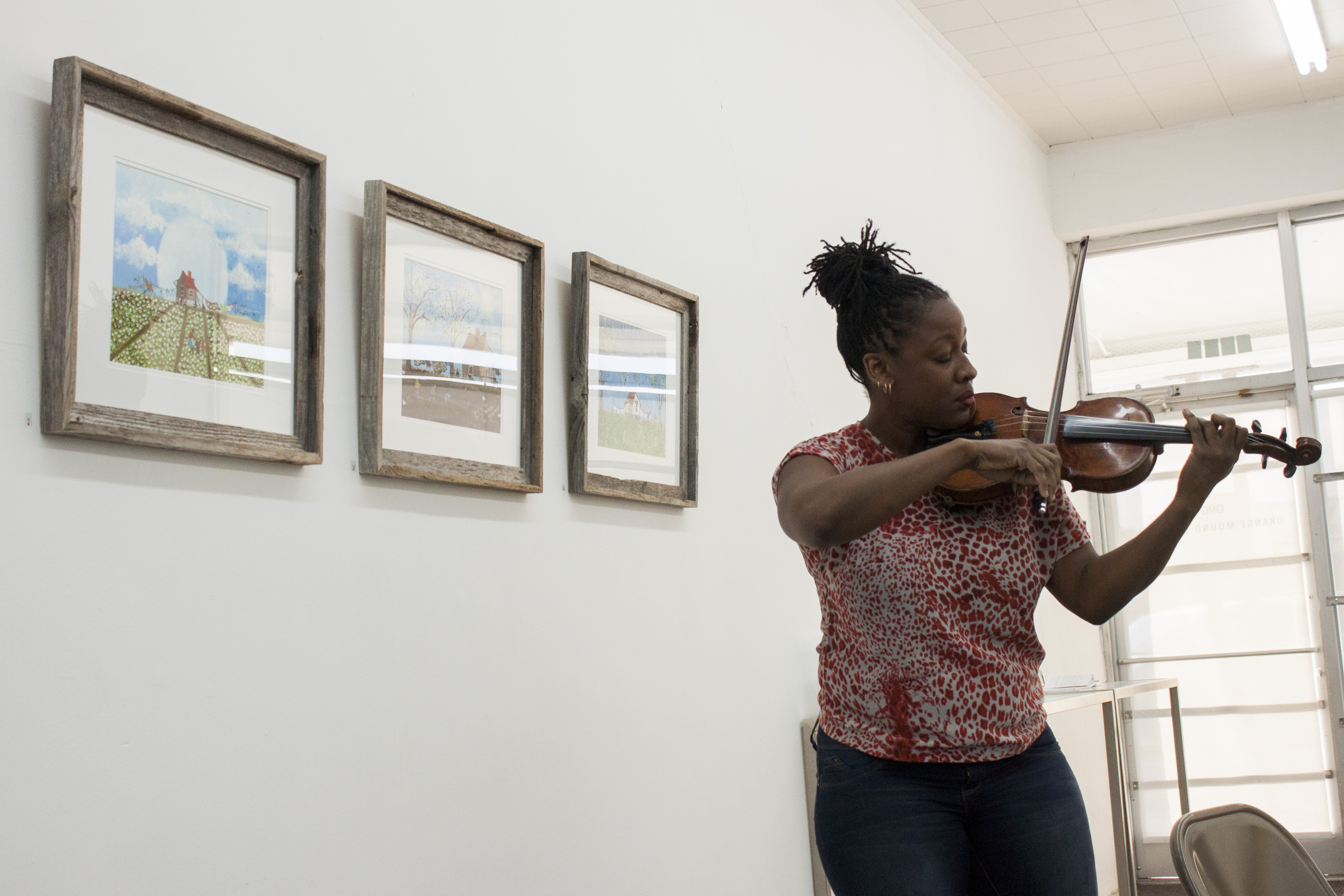 PRIZM Chamber Orchestra member Dana Kelley plays a short selection on the viola.