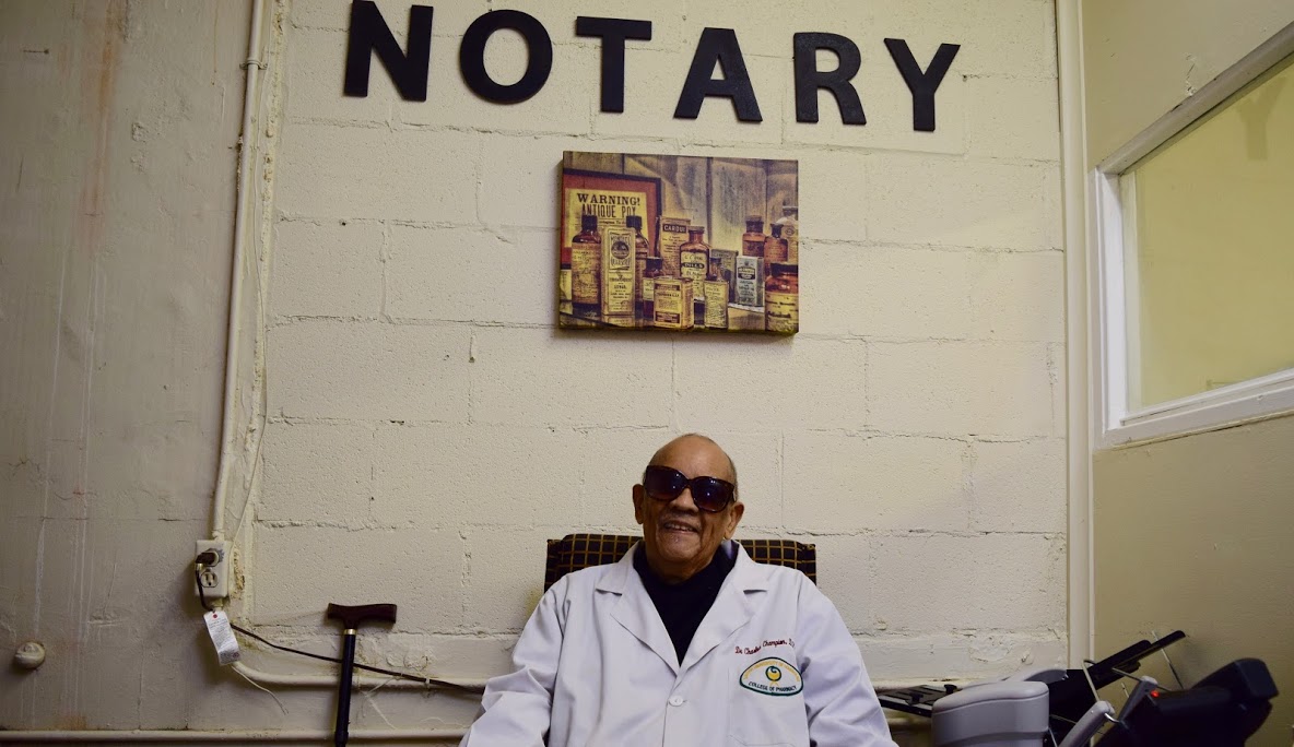 Dr. Charles Champion in his pharmacy office. (Rachel Warren)