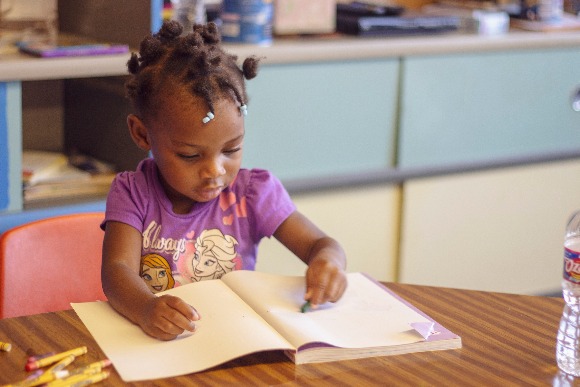 Children play at Pursuit of God Church while their parents attend class next door. The new program teaches about language and brain development for children zero to 30 months. (Agape) 