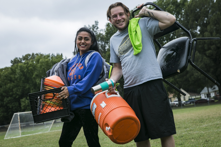 Husband and wife Nancy and Patricio Gonzalez carry equipment to the Gaisman Community Center at the end of game day. They are the directors and coaches of Illegal Arts Memphis soccer league. (Natalie Eddings)