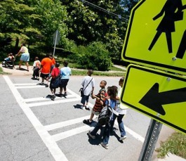 Binghampton Students cross at a crosswalk. Sidewalks and crosswalks are part of the physical infrastructure that can be improved with TIF funding. (Submitted)
