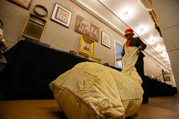 Dr. Carnita Atwater showing the bags slaves used for picking cotton.