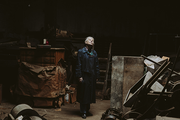 Nancy Ellis, the daughter of the founder of Wm. C. Ellis & Sons, looks out of one the building's many sky lights. (Houston Cofield)