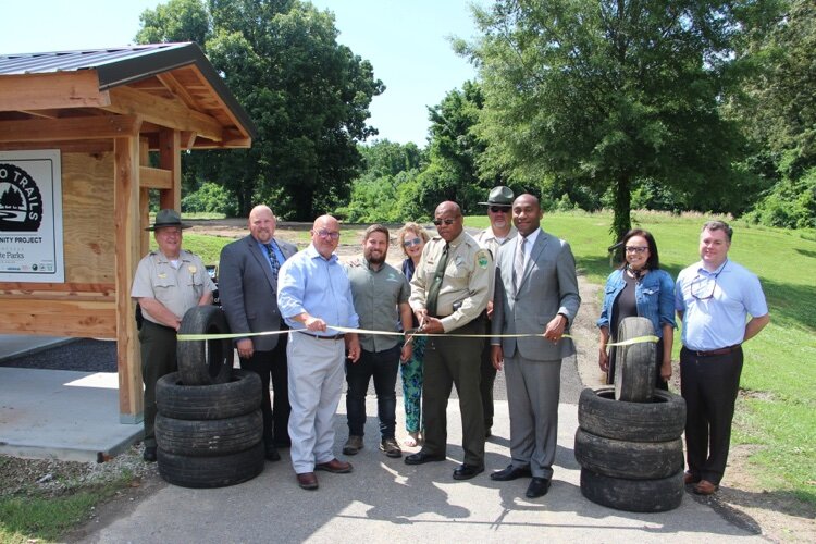 Officials gather at the ribbon-cutting for the new trail at T.O. Fuller State Park.