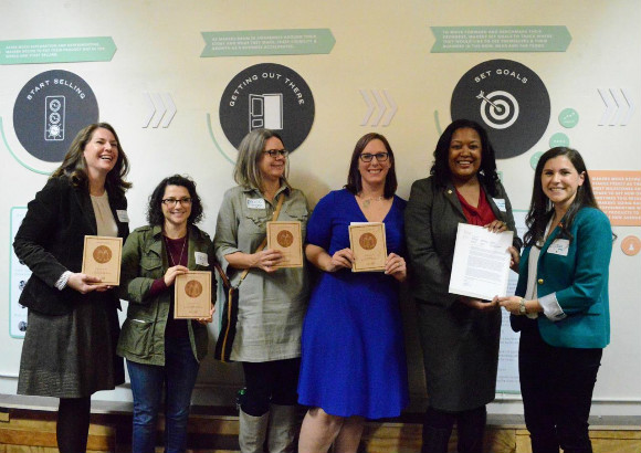 Ilyssa Meyer, public policy analyst with Etsy, awards Joanne Massey and the Memphis Action Team with Memphis' Maker City designation.