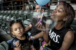 Serenity gets bubble blowing lessons from her mom at the New Memphis Institute's Exposure 901 event in September 2017. 