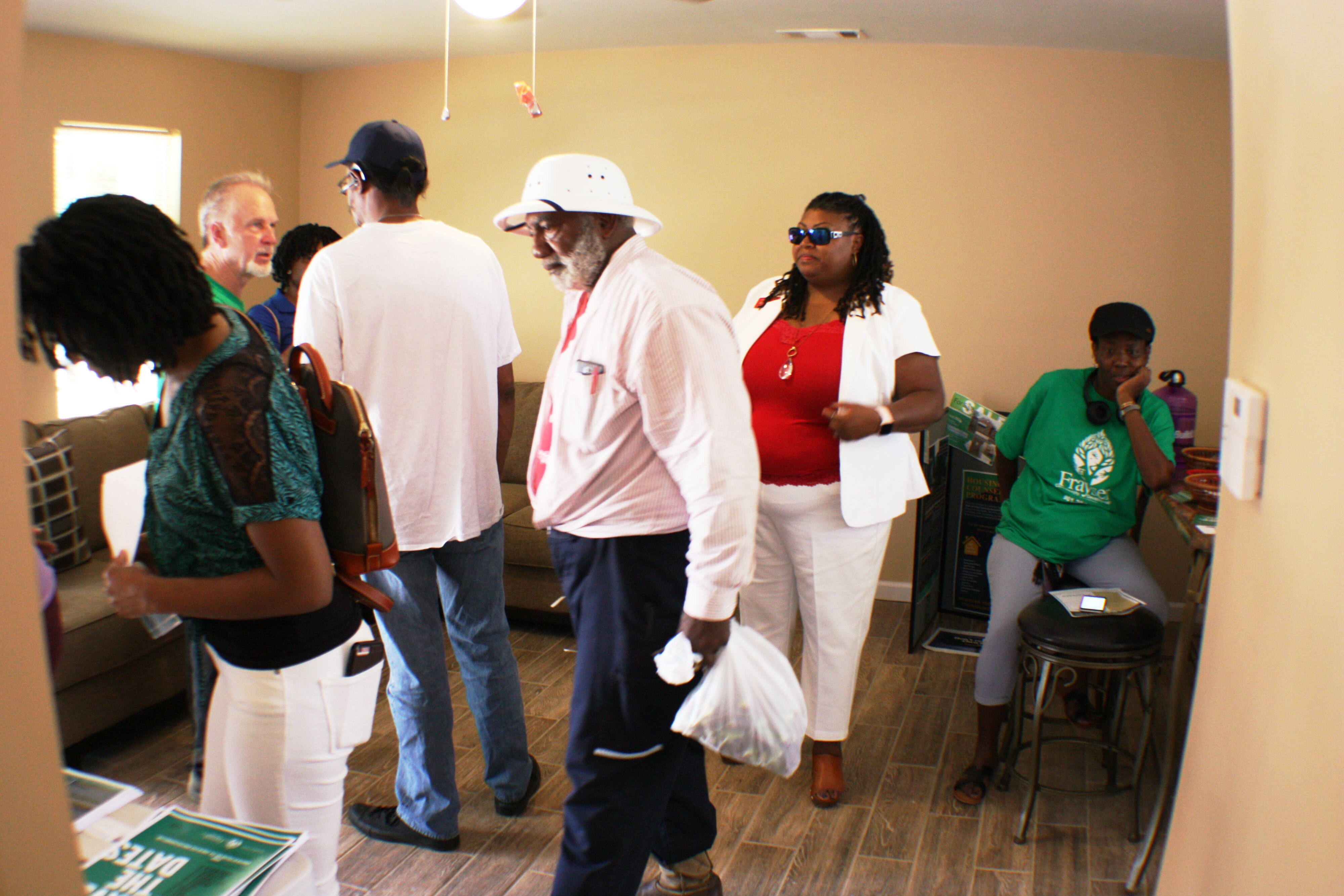 Guests of the Frayser CDC open house toured the homes and picked up literature for buying one of the three current homes or the 27 more that Frayser CDC hopes to build in the next two years. (Cole Bradley)