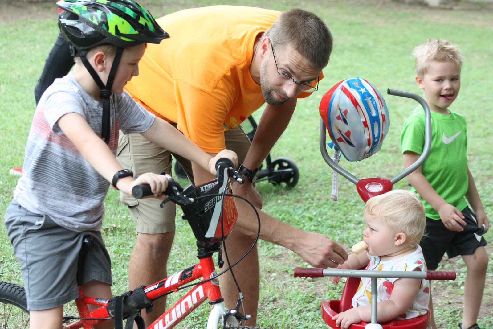 The ribbon cutting's youngest attendee samples a Mempop popsicle. (Cole Bradley)