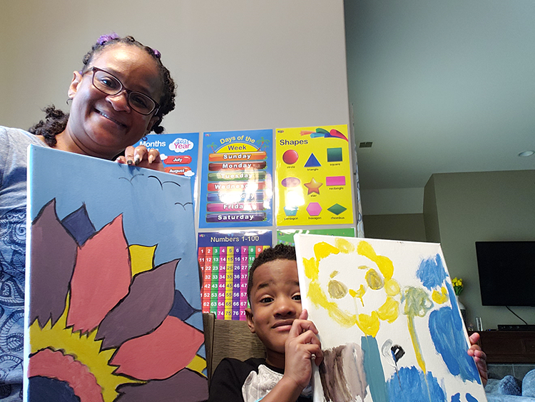 Brijin Shelton and son Xavier Shelton show off the artwork they made together as part of the Gestalt Community Schools' Known, Loved, and Educated self-care and wellness program. (Submitted)