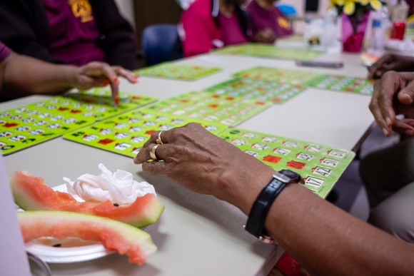 Seniors snack on watermelon and play bingo at the Bickford Community Center. (Brandon Dahlberg)