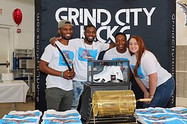 The Grind City Kicks team tables at a 901 Entrepreneur Expo pre-pandemic. The shoes were raffled off to attendees. Owner Chima Onwuka stands second from left. (photo courtesy of Chima Onwuka) 