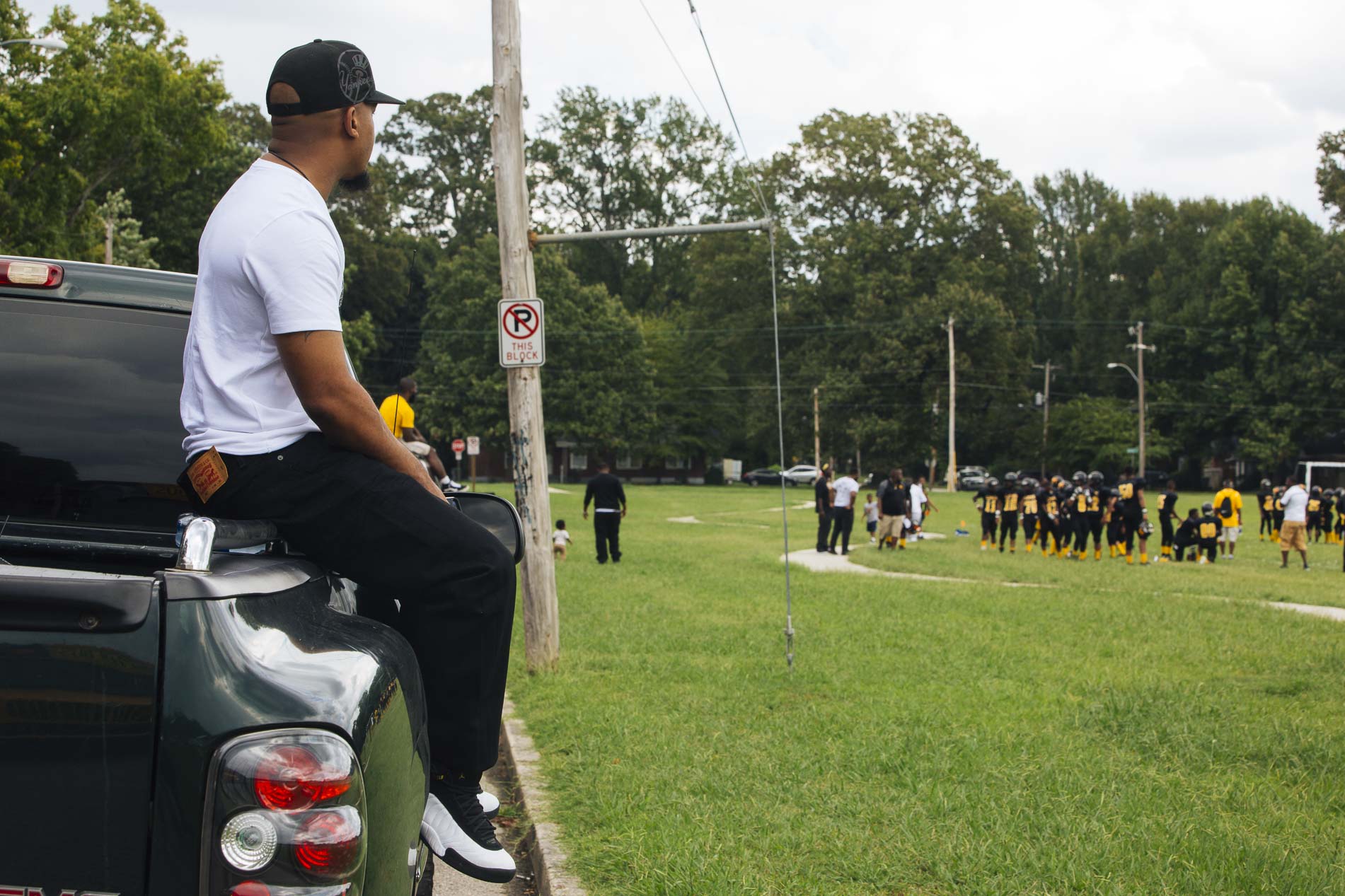 Zan 'Z' Dogan watches his son play in a football game at Treadwell Middle School. Treadwell is the area’s oldest school and opened in 1915. (Ziggy Mack)