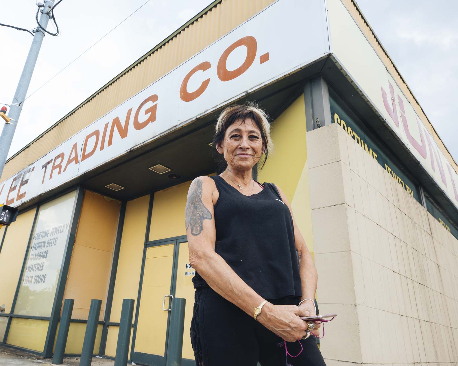 Heights resident Deborah Nahinu stands in front of Jun Lee Trading Co., a staple at Summer and National for more than 30 years. (Ziggy Mac)