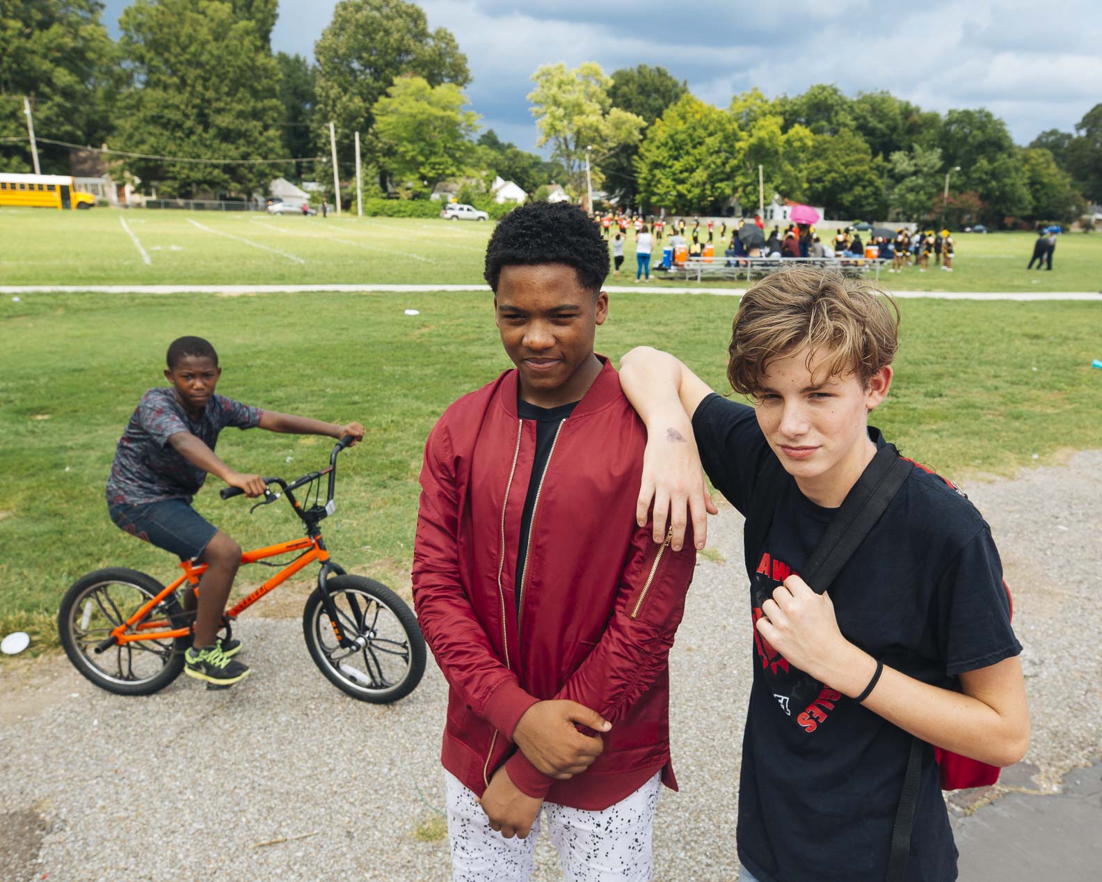 (L to R) Ladarius Shields, Cedric Hicks, and Hayden Williams attend a football game at Treadwell Middle. Treadwell is the area's oldest public school, opened in 1915. (Ziggy Mac)