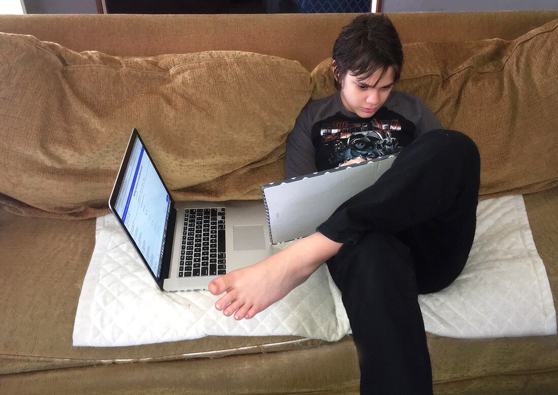 Hunter Coleman, 10, works on his homeschool math curriculum using a mix of online instruction and hands-on practice on a dry-erase board. A dry-erase board is a useful tool for practice work across subjects. (Jim Coleman).