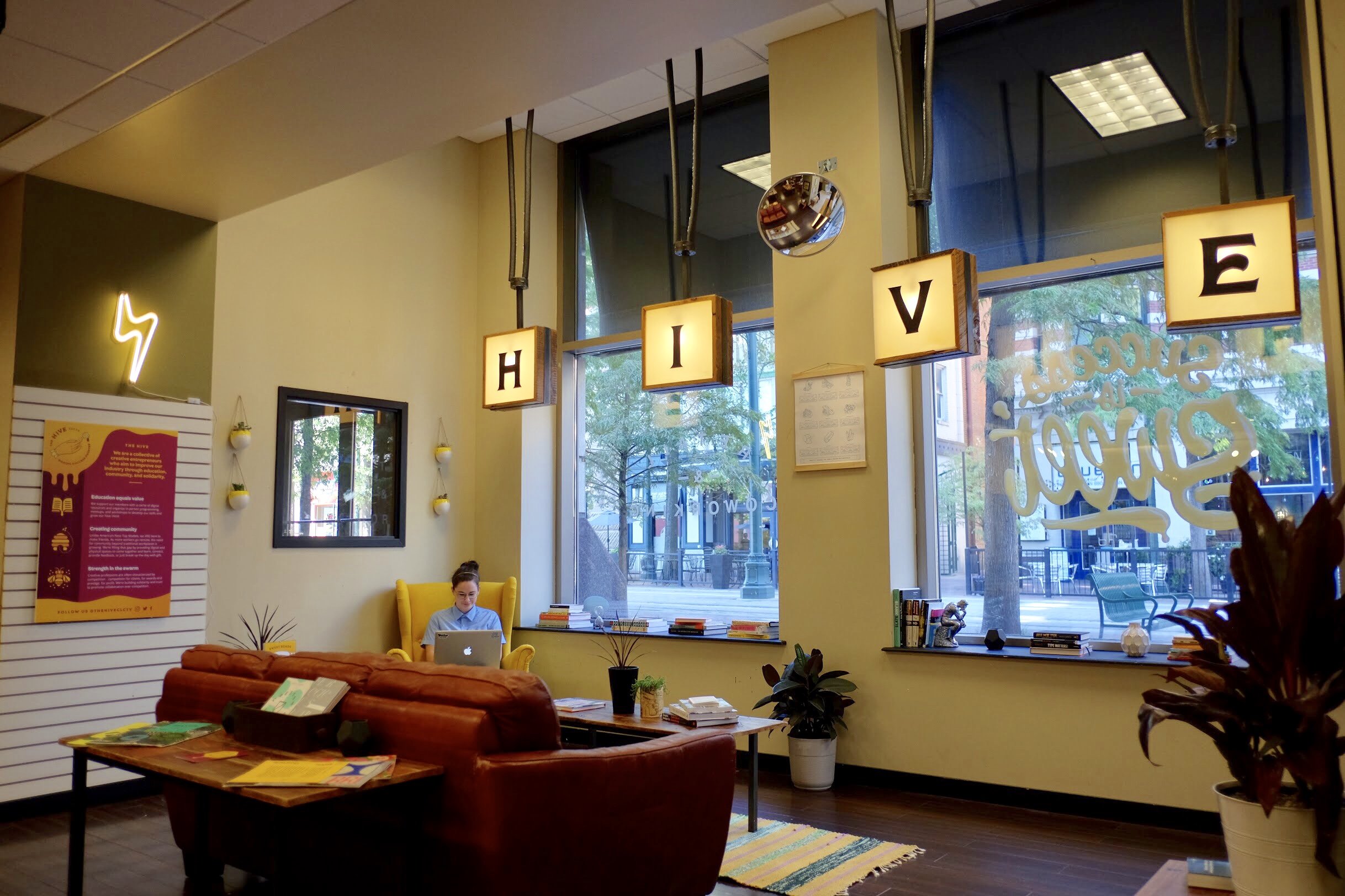 Katie Cooper, a founding member of The Hive Collective, works in the group's new Downtown space, which provides a coworking outlet for digital creatives. (Noah Glenn)