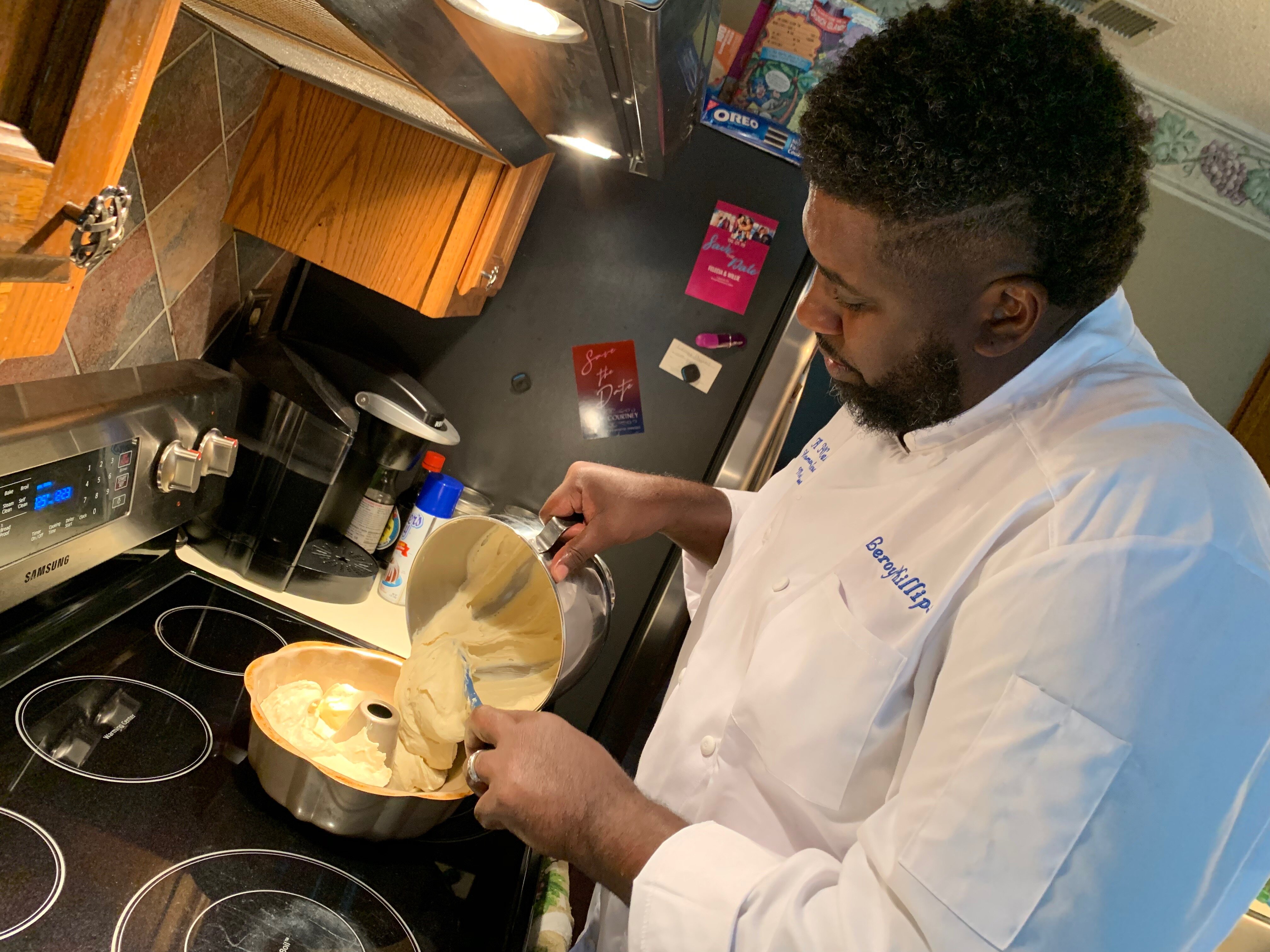 Chef Lee Phillips preps a pound cake for the oven. (Cat Evans)