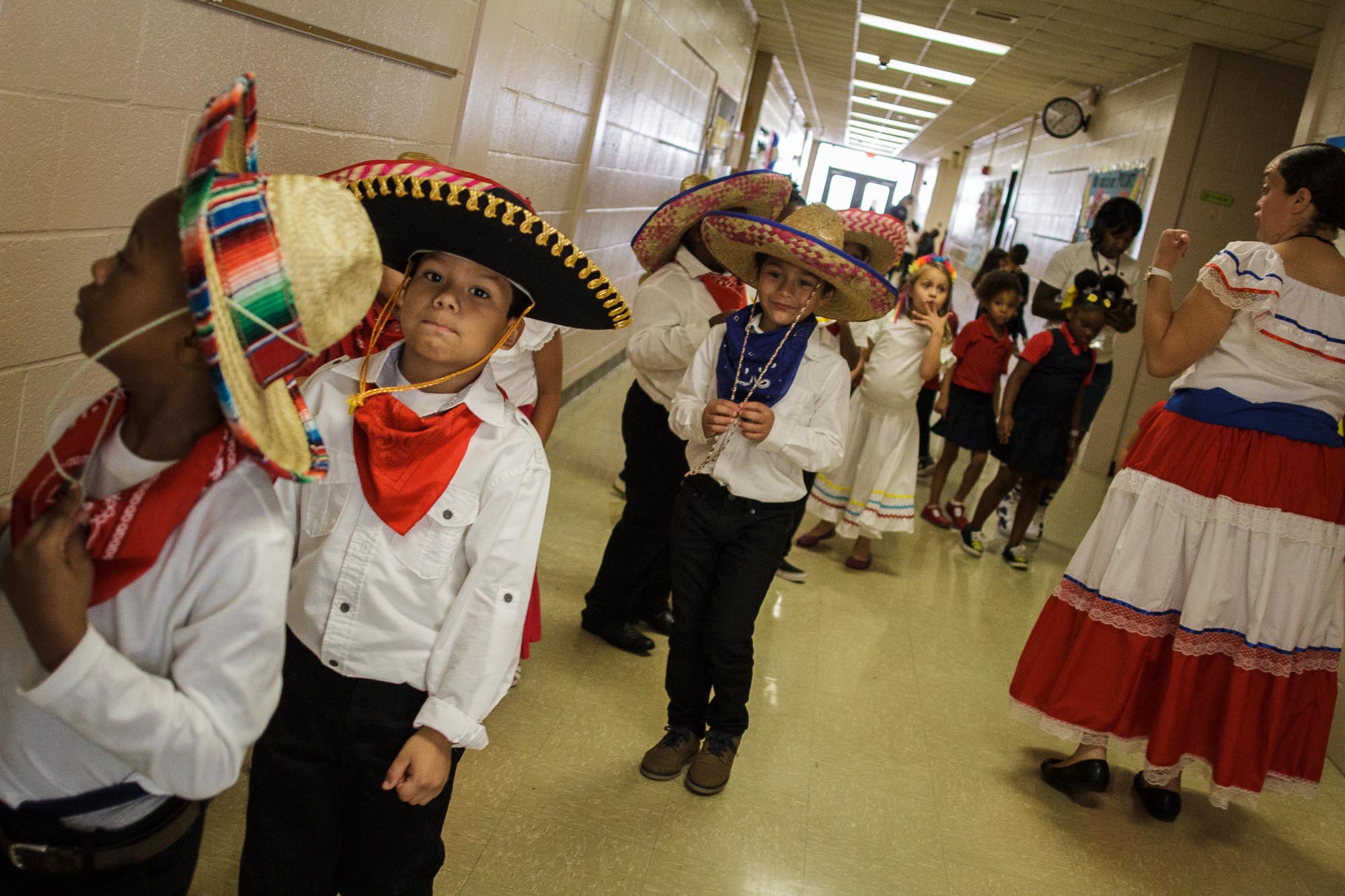 First grade students line up and prepare to sing Cielito Lindo, a popular Mexican song as part of Treadwell Elementary School’s celebration of Hispanic Heritage Month. (Renier Otto)