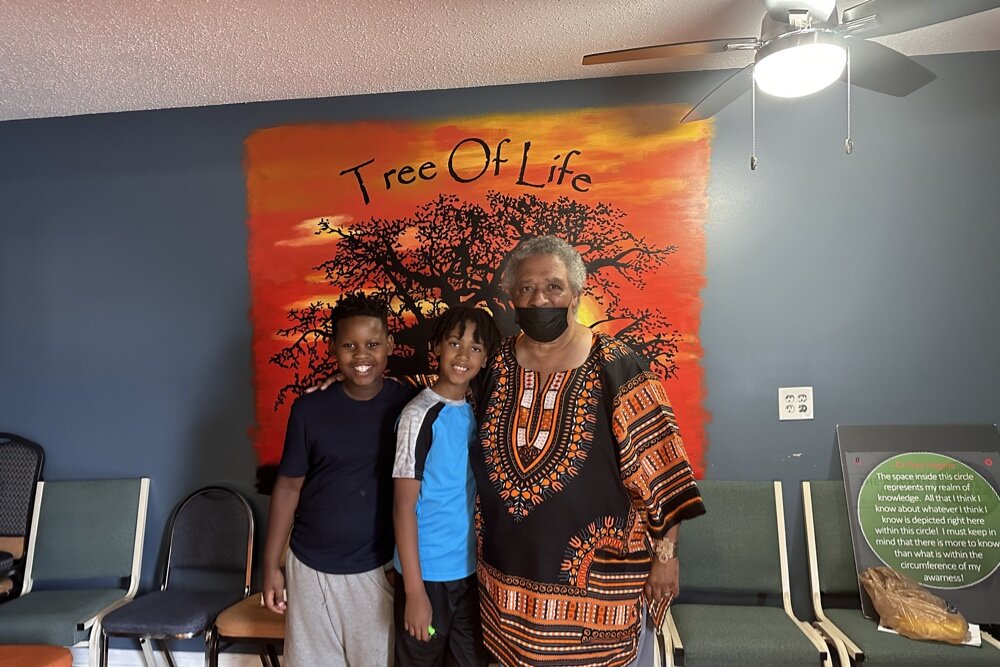 Tailor Jackson (L to R), Elijah Redwing, and Afrikan Village Institute founder Norman Ray Redwing, Jr.