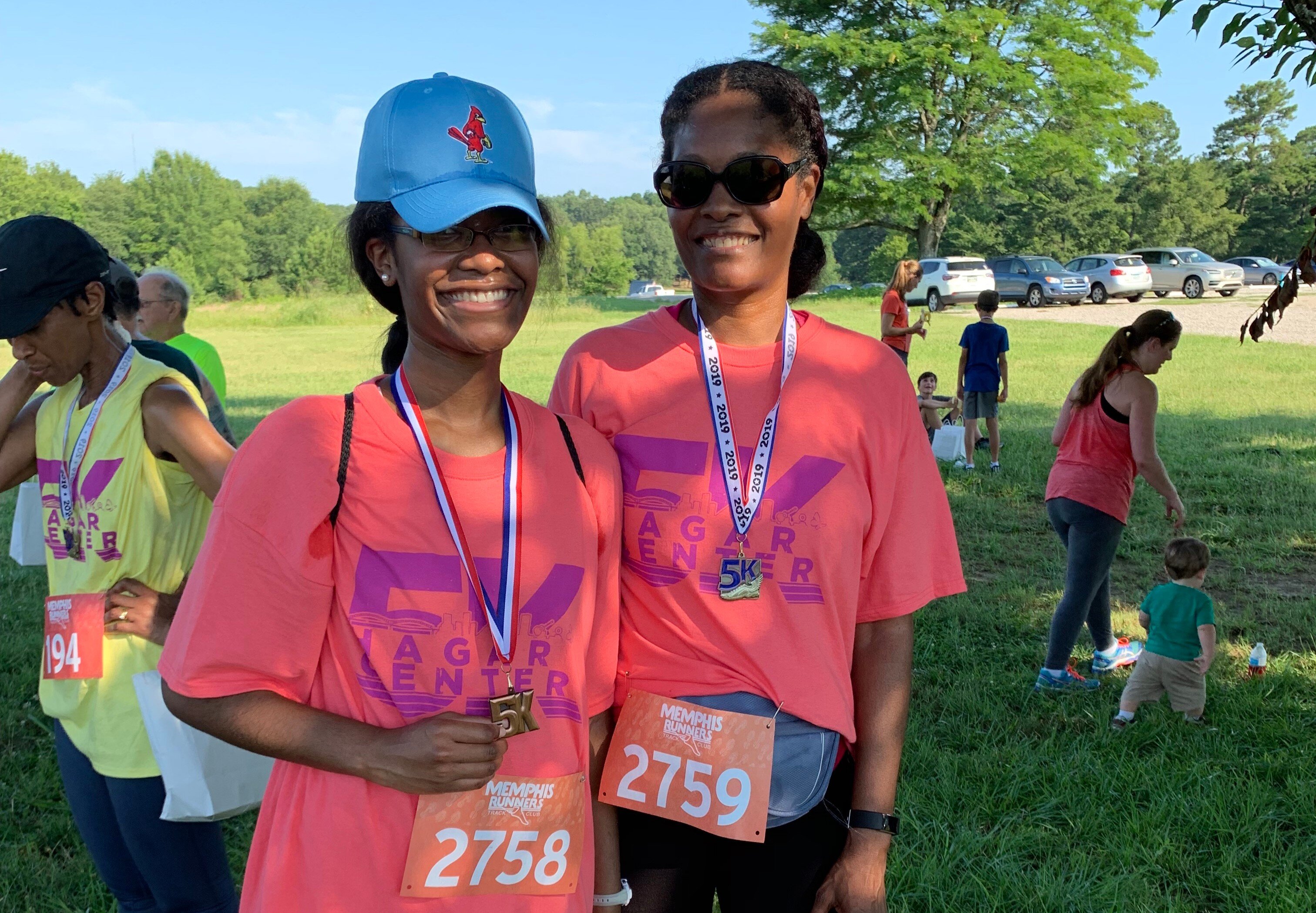 Stephanie Parker-Bradley and her daughter, Faith Bradley, celebrate after completing The Hagar Center 5K Fun Run. (Ashlei Williams)