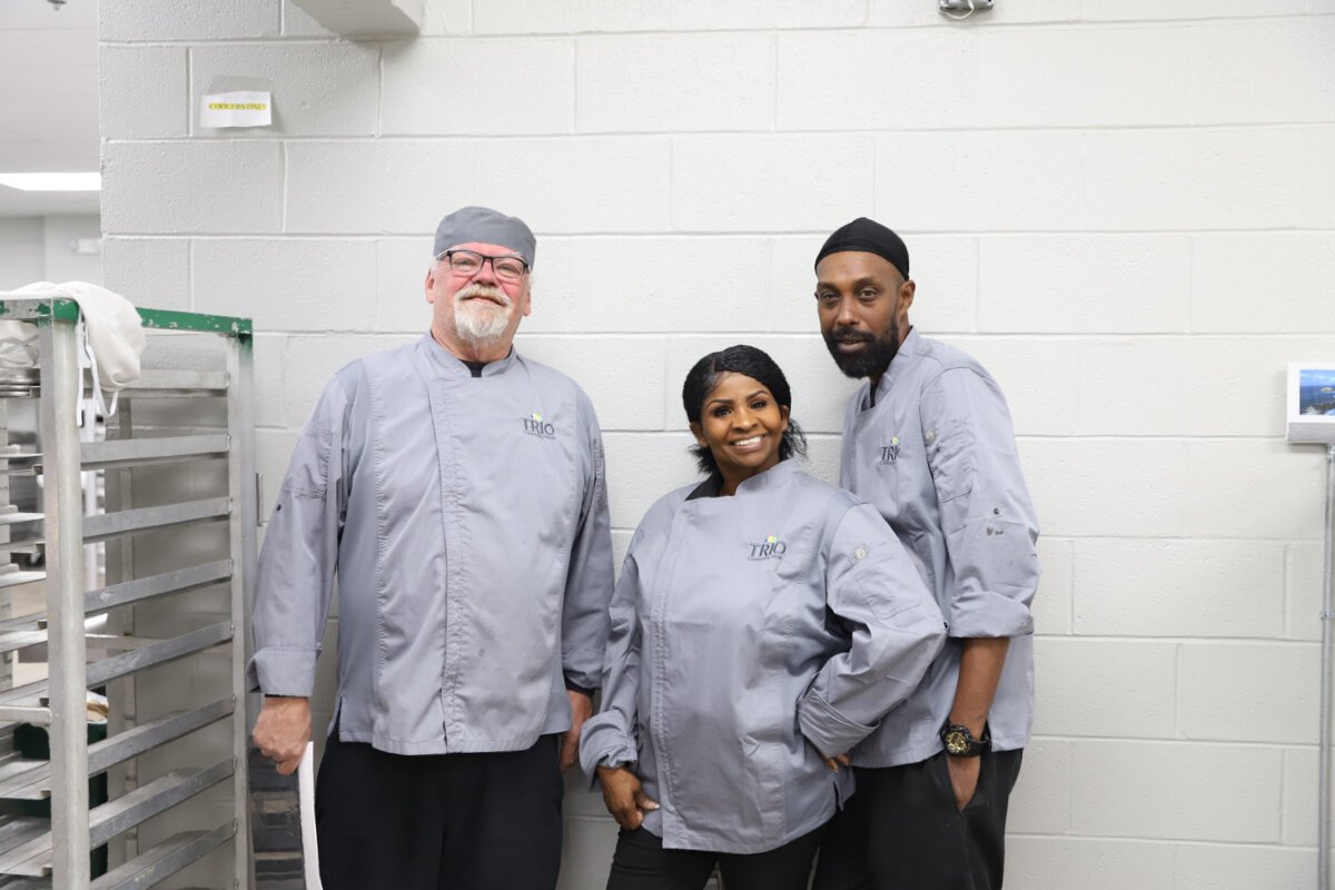 Chef Leland Tripp (left) and his colleagues in the MIFA kitchen. Says Tripp, "I came to MIFA to pay it back, because God has treated me so well. He guided me here. My staff of 13 that works with me to prepare these hot meals feel the same way."