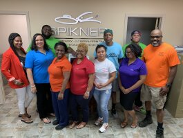 This year marks 24 years in business for Spikner Embroidery and Screen-Printing, which now has nine employees and is located in Madison Heights. The staff is pictured here with owner Fred Spikner at far right. (Ashlei Williams)