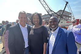 Gov. Bill Lee (L to R), Greater Memphis Chamber extern Tracy Thomas, a teacher at the Trezevant Career & Technology Center, and externship host Ron Redwing, CEO of The Redwing Group, at the signing of the Transportation Modernization Act in Memphis.