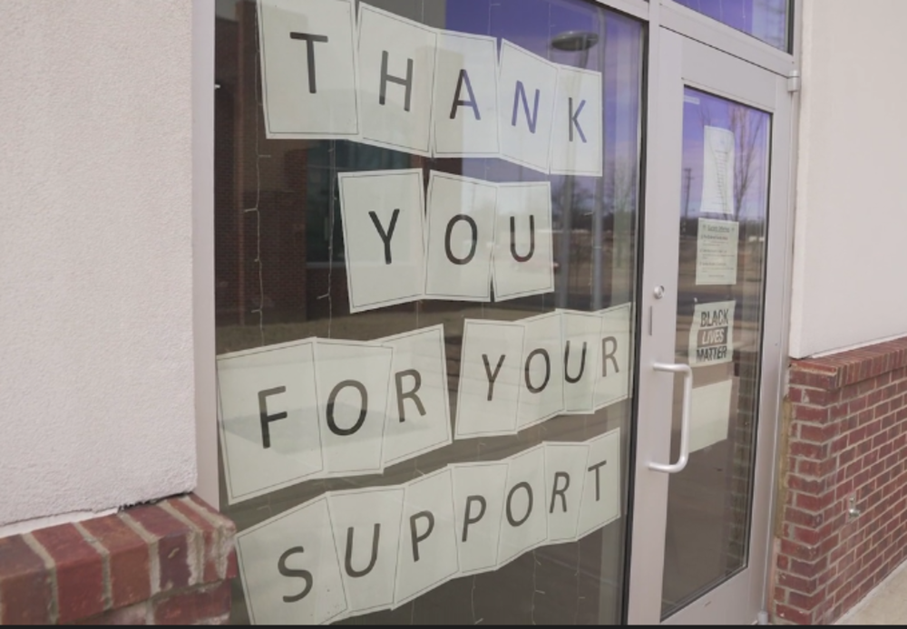 A sign on the windows of Inspire Community Cafe thanks passing customers driving on Sam Cooper Boulevard for their support. (Forever Ready Productions) 