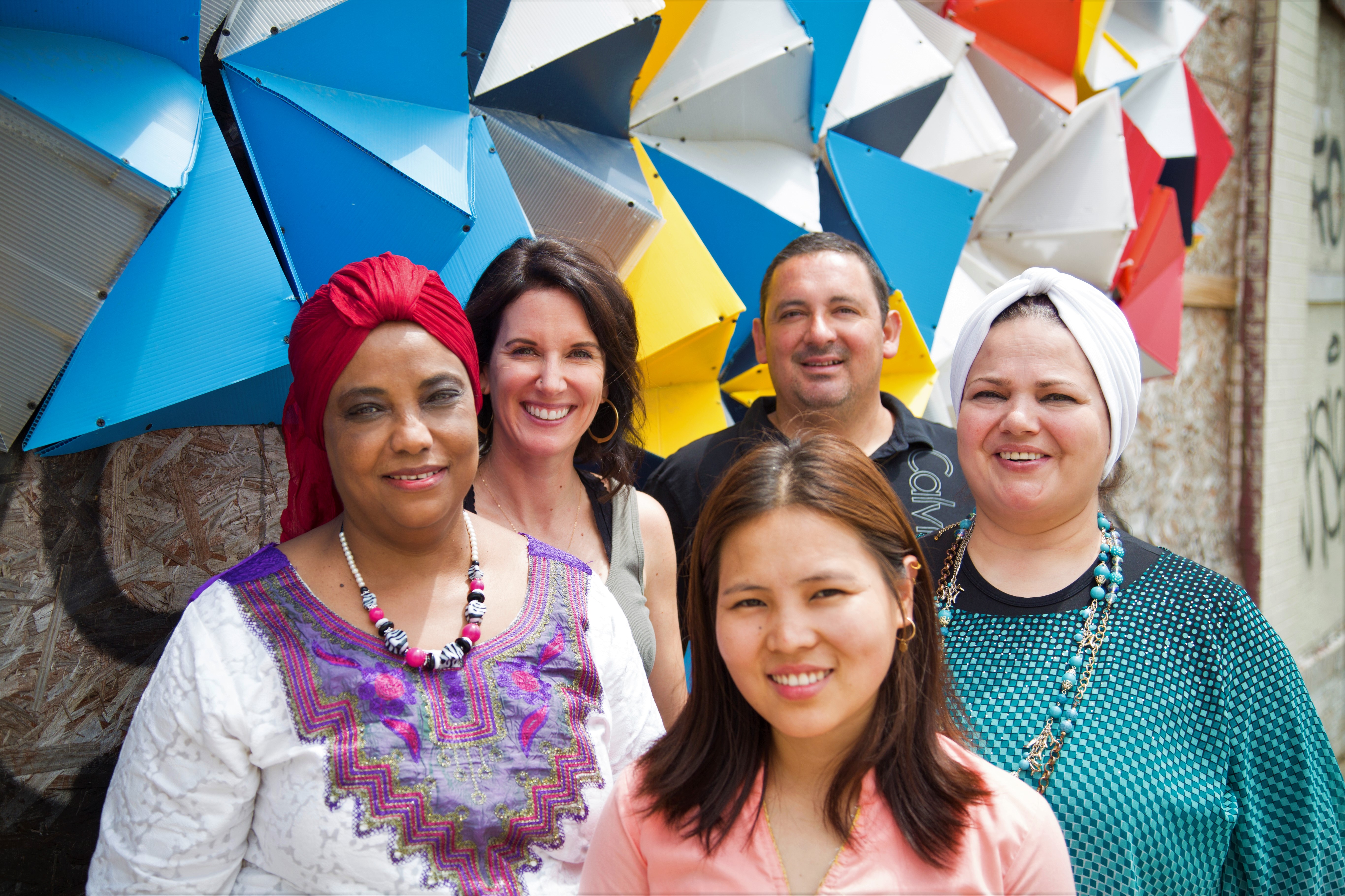 Global Cafe Founder Sabine Langer and General Manager Juan Viramontes with local food entrepreneurs from Sudan, Nepal and Syria. Left to right, Ibti, Sabine Langer, Juan Viramontes, Fayha, and Indra. (Yasmine Omari)