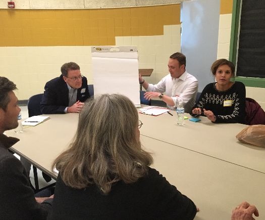 Alex Feldman of U3 Advisors, center right, leads one of four small group discussions at the final public forum to reimagine Rust Hall and the Brooks building. (Kim Coleman)