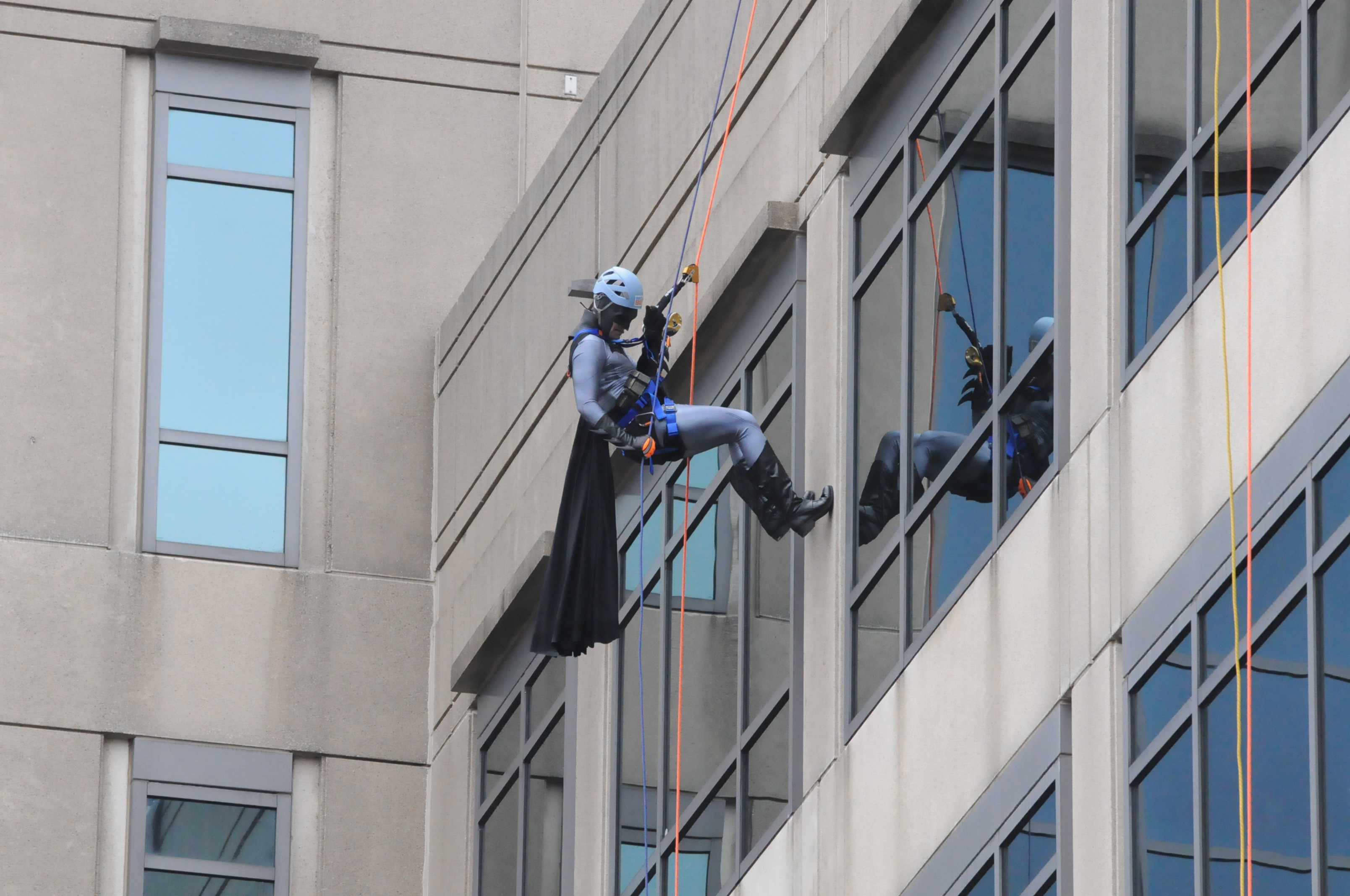 Participants rappelled down the AutoZone building downtown in all manner of costume, including Batman. (Kindred Place)