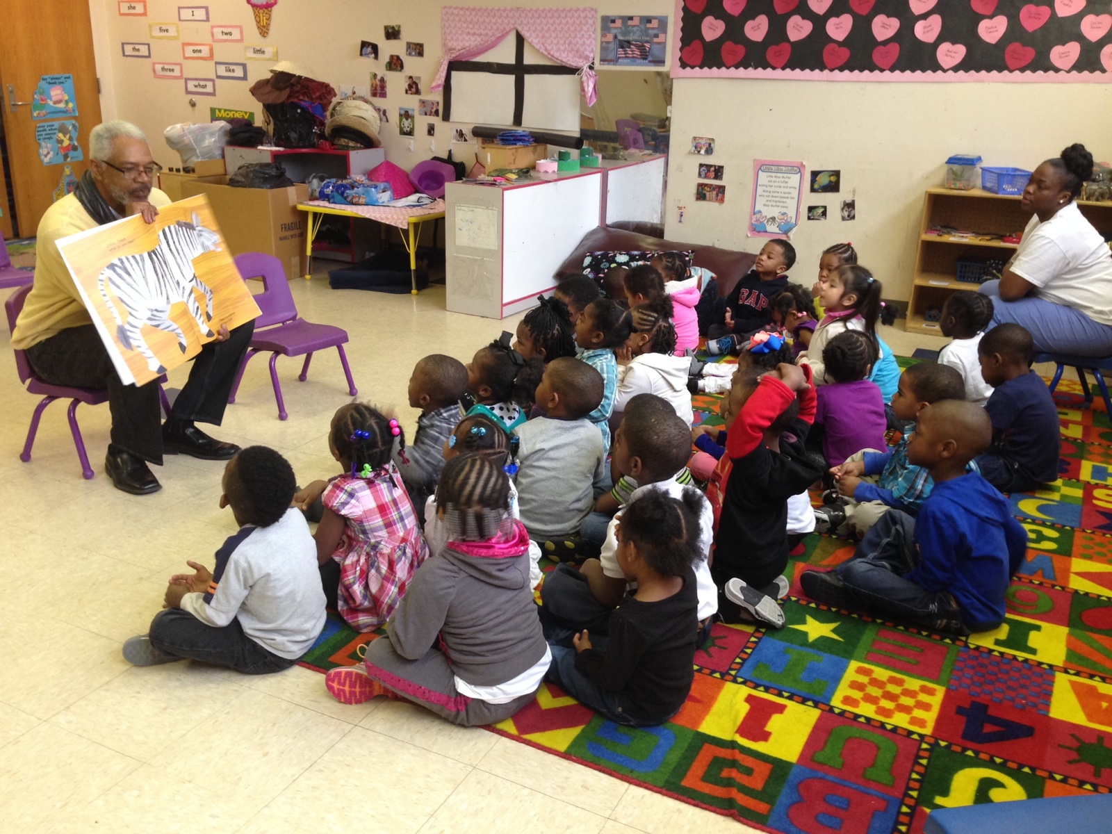 Children listen to a story as part of Cornelia Crenshaw Memorial Library's Real Men Read program. The exterior of Crenshaw and Randolph libraries are in need of attention, but inside, they're bright and active centers of community. (Memphis Library F