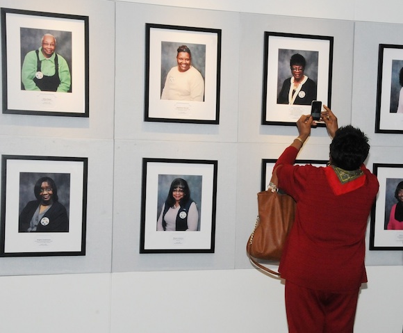 Portraits of breast cancer survivors line the walls at the Live! Just as We Are exhibit 