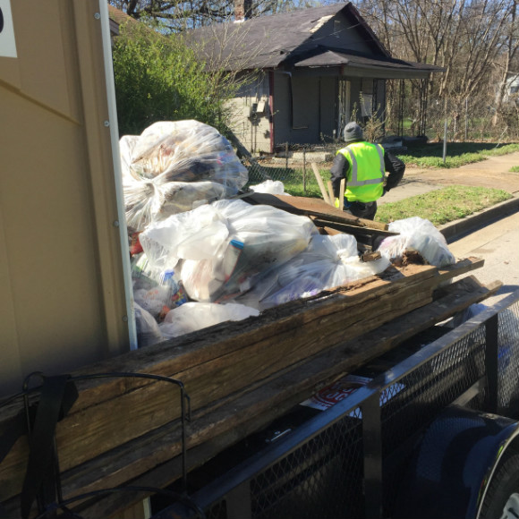 A Work Local crew member cleans up Lamar Avenue.