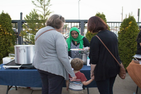 Ibtisam Salih sells soup and cornbread at the 10th annual Broad Avenue Art Walk.  