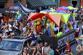 The street is filled with rainbows and parade participants at the 2016 Memphis Pride Parade. (photo courtesy of the Museum of Science & History/Pride Archives)