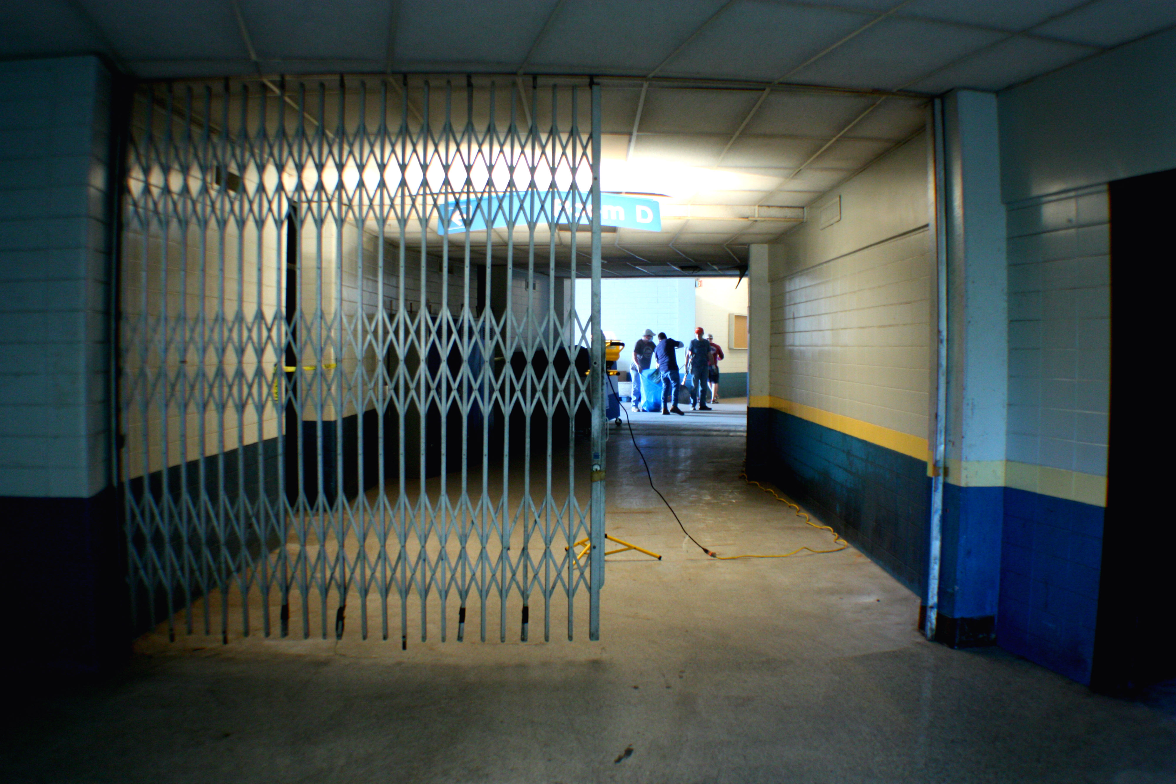 Volunteers work in the Coliseum's lower-level loading dock entrance. The building's arena and corridors were lit by task lighting provided by the City of Memphis. (Shelda Edwards) 