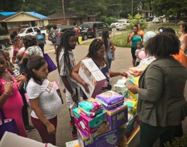 Expectant moms received diapers, wipes, baby clothes, a co-sleeper and more. (Cole Bradley)