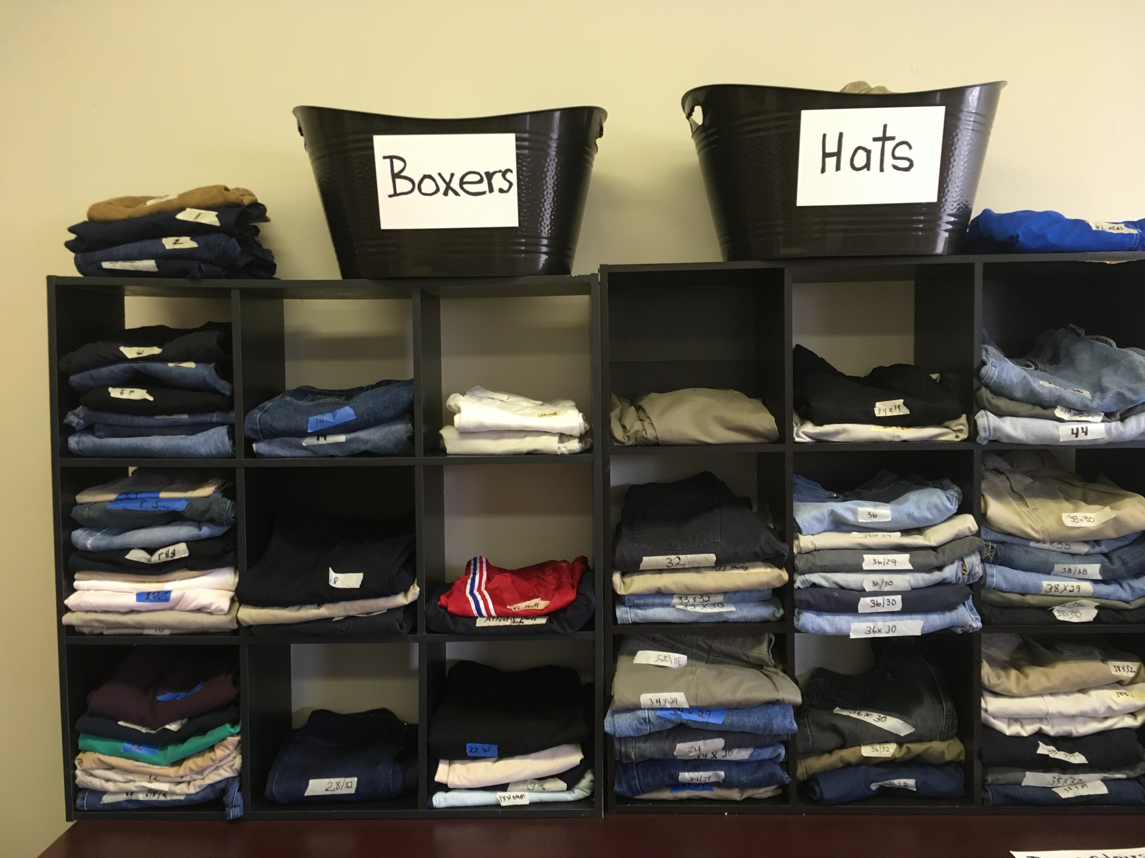 People participating in the food mission or shelter program can access the Ozanam Center's clothes, shoes, linens and toiletries supplies. Items are displayed like a retail store to give guests a dignified, catered experience. (Kim Coleman)