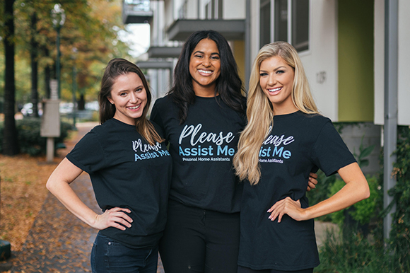 Stephanie Cummings, Please Assist Me CEO and co-founder, center, along with two Please Assist Me assistants, help users with tasks they might be too busy for like cleaning the house or doing laundry, as part of a newly launched startup accelerator.