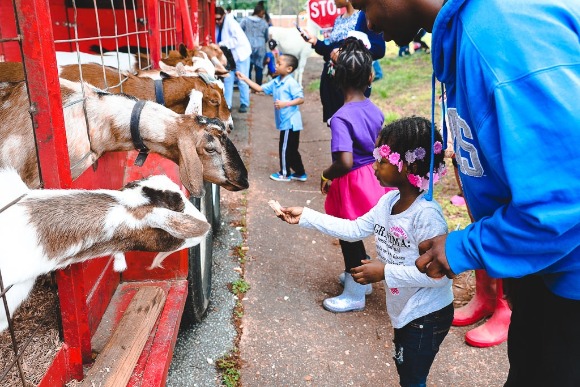 Xadion Woods brings his daughter, Taylor, to the Pre-K and Kindergarten Kickoff at the Board of Education on Saturday, May 5th. Woods is attempting to enroll his daughter in kindergarten this upcoming year. (Kirstin Cheers)