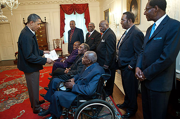 President Barack Obama talks with participants from the 1968 Memphis sanitation strike during a meeting in the White House on April 29, 2011. 