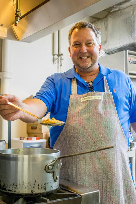 Carter Beard shows off his pepper jelly in the commercial kitchen of First Congregational Church.