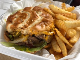 The Uptown Burger features two beef patties, cheese, onions, peppers, and jalapenos grilled to perfection.  (Cole Bradley)
