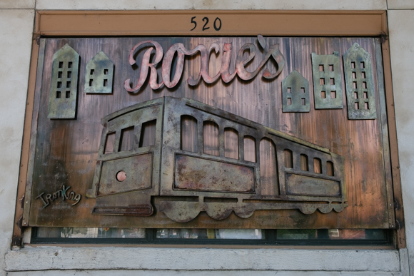 The ironwork sign at Roxie's depicts the Main Street trolleys  (Brandon Dahlberg)