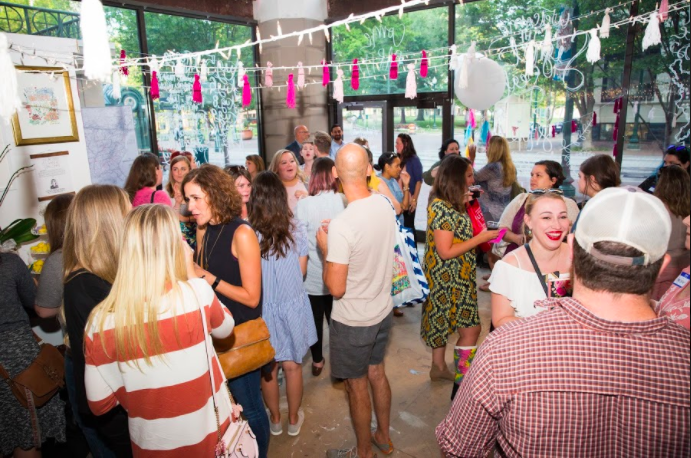 Local members of the Rising Tide Society mingle at an August meeting held at a pop-up shop on 9 North Main Street. (Kristin Archer)