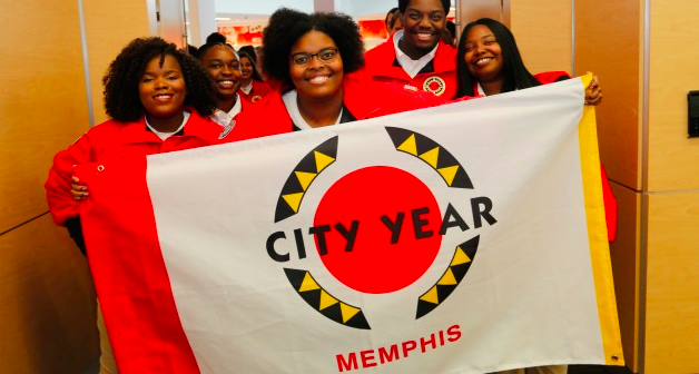 City Year volunteers work with students inside and outside the classroom to help them reach graduation. 