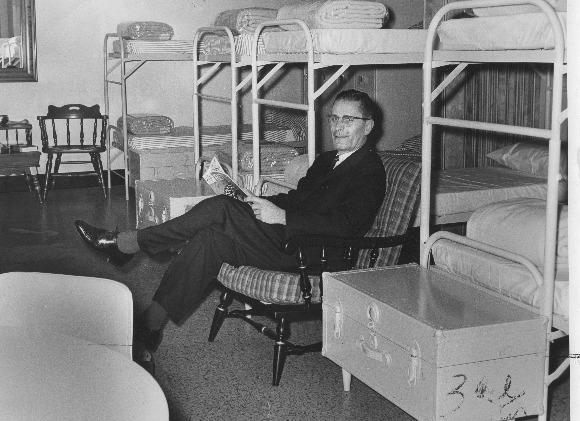  Russ Hodge, WREC-TV announcer, relaxing on one of the shelter's bunk beds. (University of Memphis special collections)