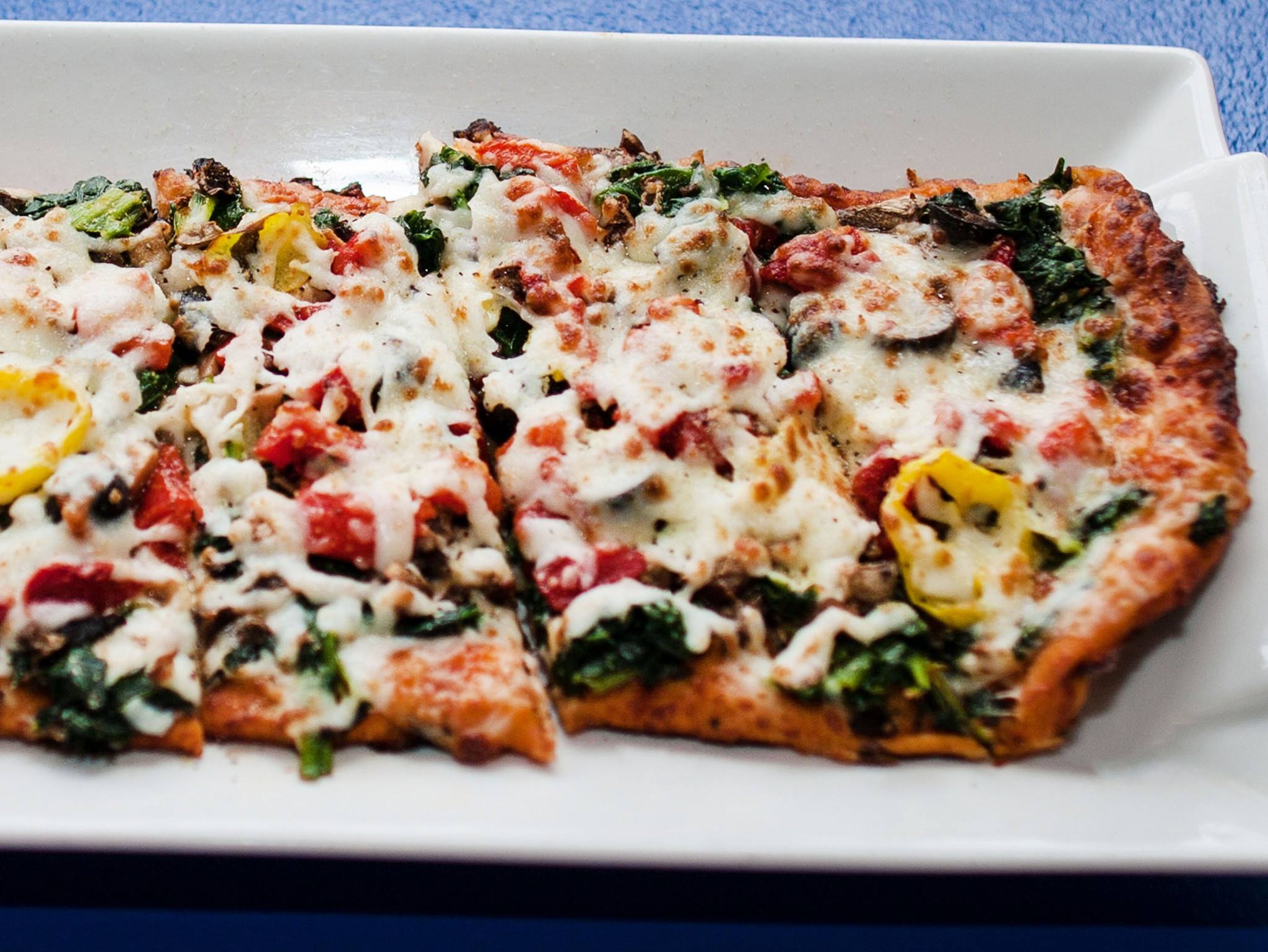 Slice of Soul’s signature Al B. Green Pizza, with spinach, black olives, green olives, mushroom, onions, roasted red peppers, and green bell peppers. (Submitted)