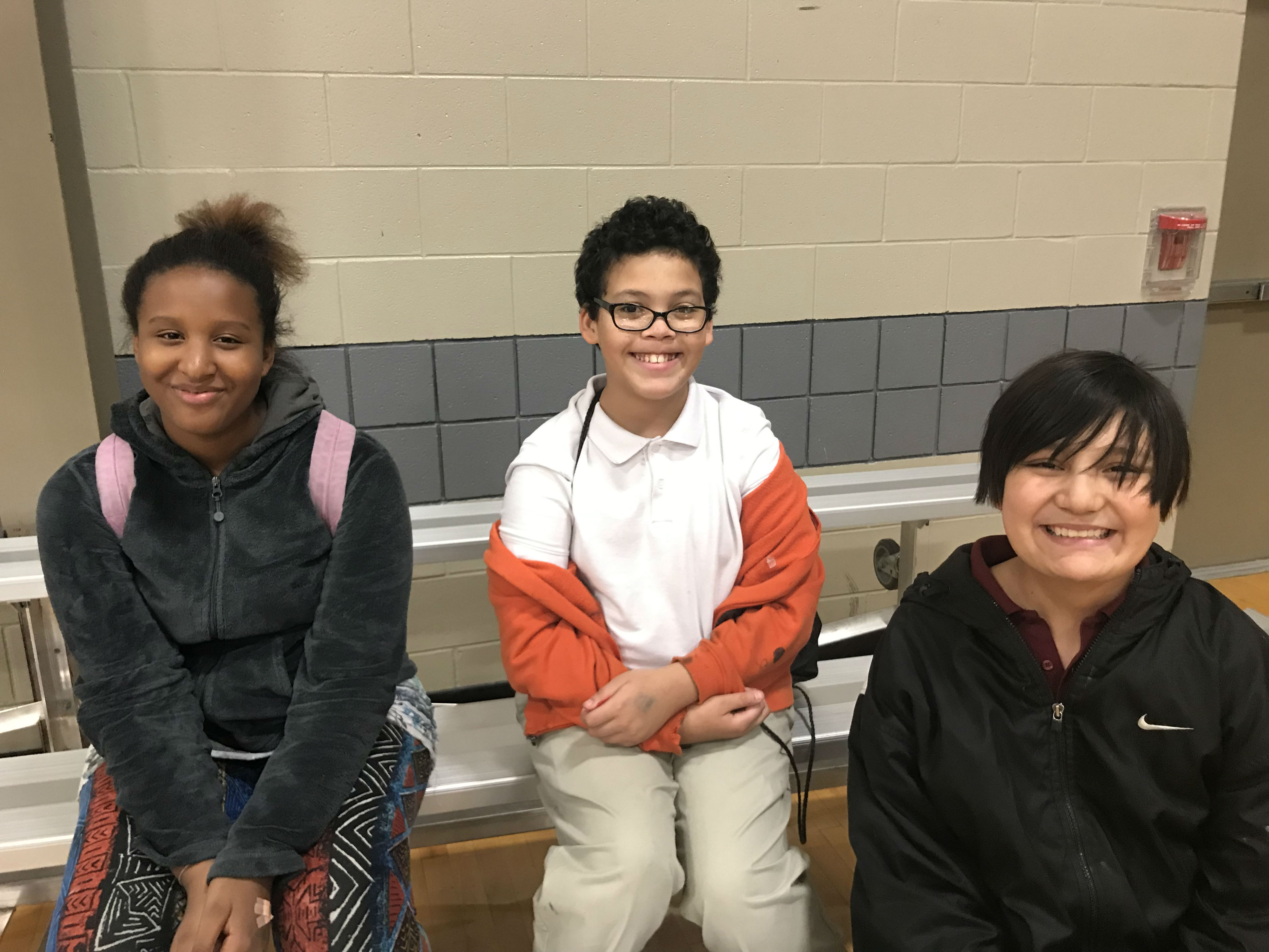 Sariah Hudson, 12, Antonio McPherson, 12, and Jose McClellen, 14, hang out with friends and participate in programs after school at the Heights campus of STREETS Ministries. (Dawn Neuses)